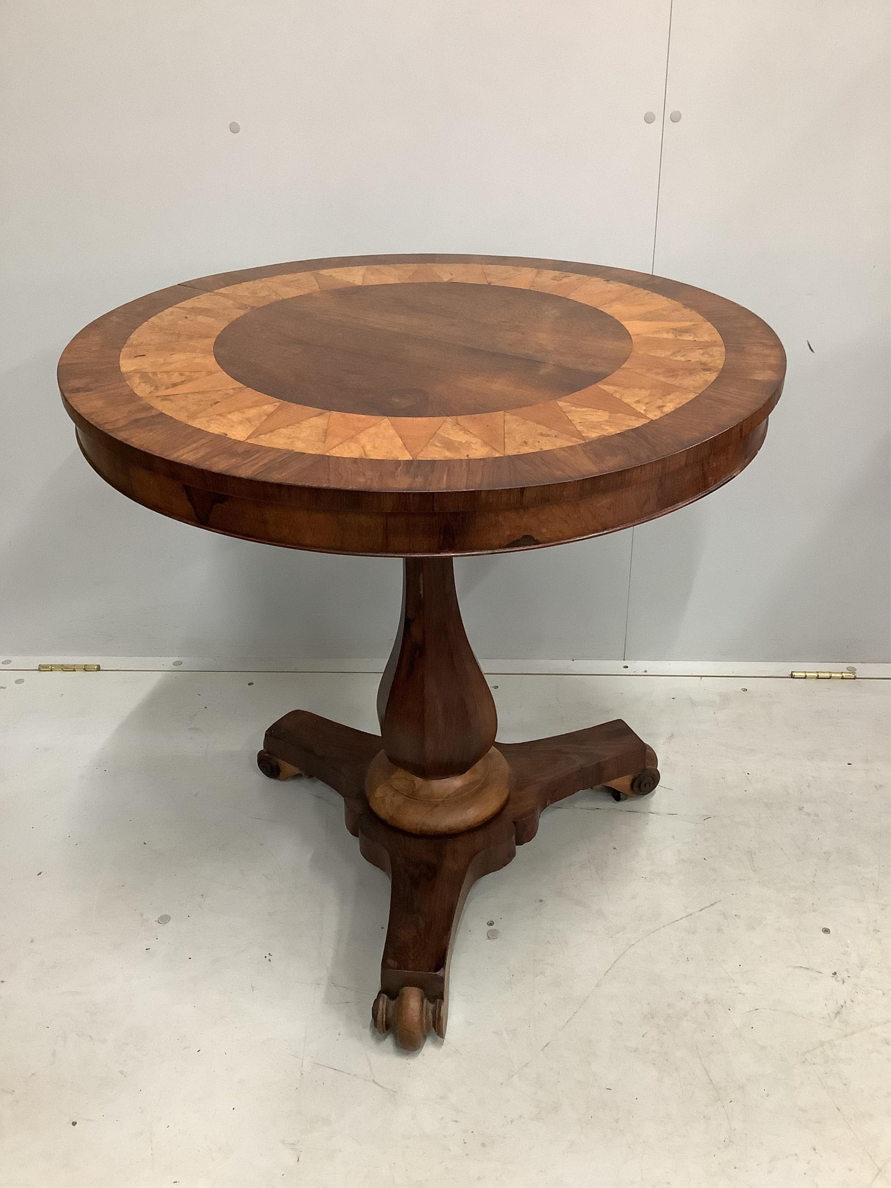 An early 19th century Continental rosewood, walnut and satinwood centre table, with parquetry top, diameter 76cm, height 75cm. Condition - fair to good